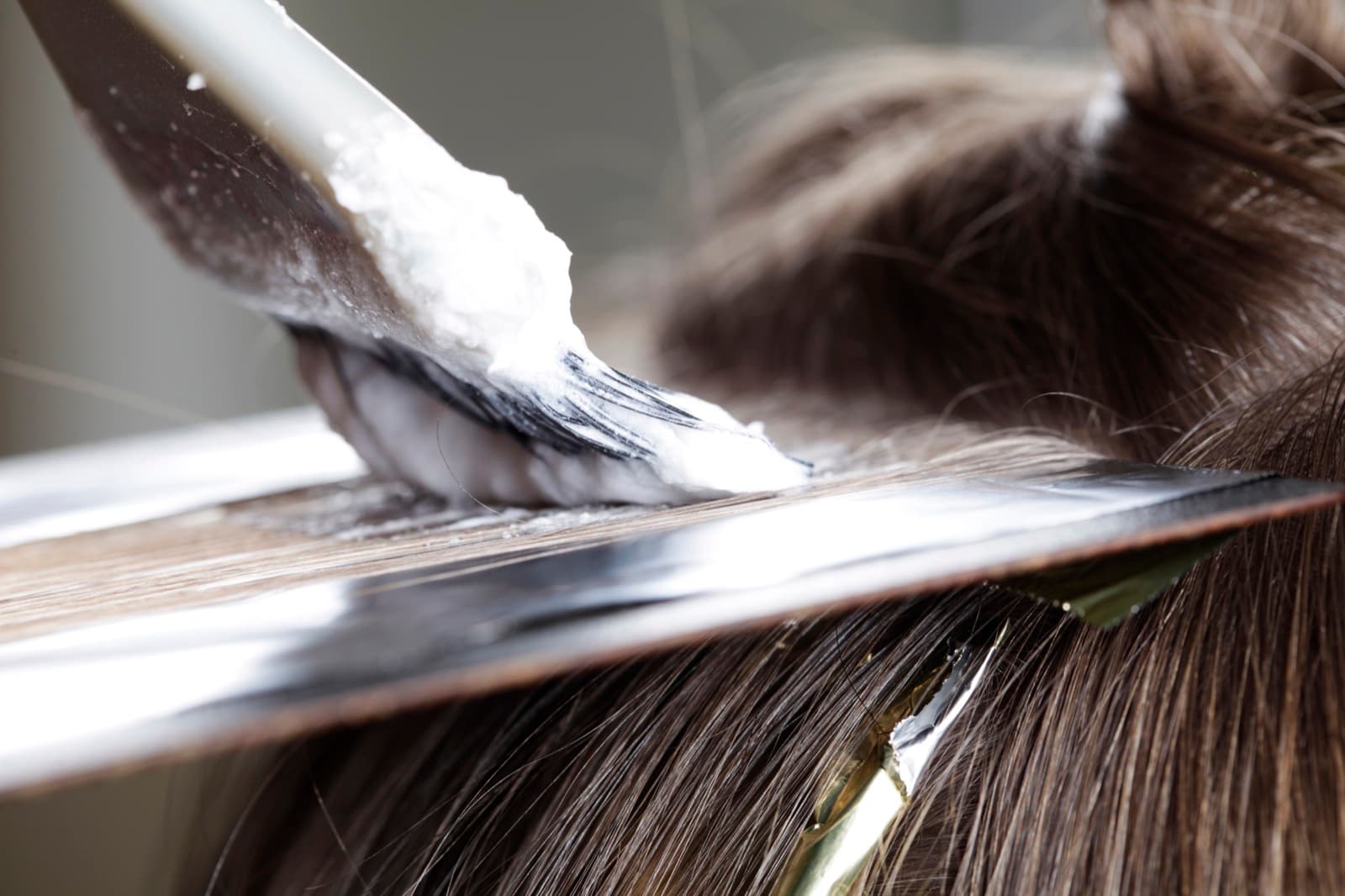 Foils being placed during a color service at YK Salon