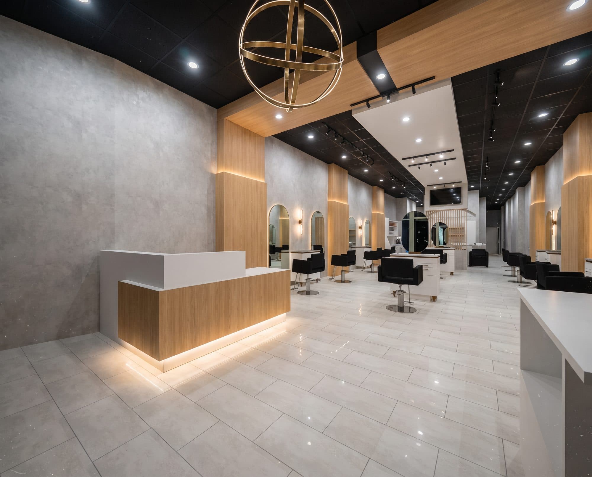 The reception desk and open styling floor at YK Salon